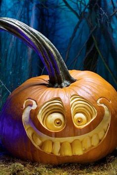 a pumpkin with an evil face carved into it