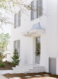 a white house with windows and shutters on the front door is seen on instagram