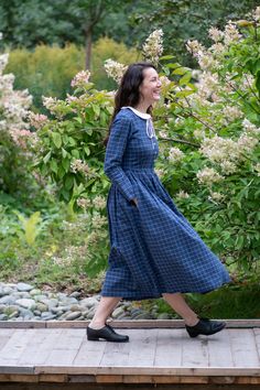 Linen Gingham Dress, Peter Pan Collar Dress, Amish Linen Dress ❃ Your wardrobe should be versatile to suit all occasions and weathers! This blue plaid linen dress has been designed with that in mind, having a neat button-down top that's complemented by a full, pleated midi skirt (with pockets). The white Peter Pan collar and cuffs are detachable so you can vary your look from prim to party-ready! ❃ Features * Available in 40 colors *Handmade *Natural fabric - 100% linen *100% cotton fabric *Deta Long Sleeve Gingham Plaid Dress For Daywear, Long Sleeve Gingham Dress For Work, Knee-length Gingham Dress For Daywear, Long Sleeve Gingham Dress For Picnic, Puritan Dress, Dress Peter Pan Collar, Pan Collar Dress, Midi Skirt With Pockets, Shirt Linen