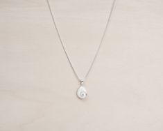 "Handmade Sterling Silver Necklace with a round polished natural shiva shell and a silver chain. This unique piece is formed by a Shiva shell of 18mm diameter into a silver pendant. Shiva eye is also called \"Santa Lucia Stone\" or \"Ojo de Santa Lucia\" in some areas. A completly natural and beautiful shell. You can wear it on both faces of the shell. This shell is the a perfect present for all those women who loves the sea and natural beauty. Details: - 925 Sterling Silver stamped. - Able for White Sterling Silver Shell Necklace For Gift, White Sterling Silver Shell Necklace As Gift, Shiva Eye, Spiral Necklace, Lapis Lazuli Ring, Santa Lucia, Pendant With Chain, Gem Ring, Blue Gems