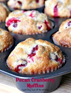 a muffin tin filled with fresh cranberry muffins