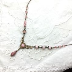 An exuberant vintage style floral necklace in soft pink colors attached to a beautiful pendant. Most beads are Czech glass and crystal glass. The cabochon is polaris and has a beautiful silky pink color. A perfect necklace to combine with a simple dress, or to wear on a simple t-shirt and turn it into an eye-catcher. You may choose the desired length in the drop down menu. -------------------------------------------------------------------- All material is lead and nickel-free. Shipping will be Czech Glass Necklace, Pretty Jewelry Necklaces, Diy Jewelry Projects, Simple T Shirt, Soft Pink Color, Simple Dress, Simple Tshirt, Pink Necklace, Brass Necklace