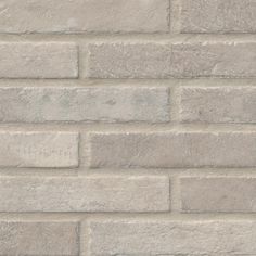 a close up view of a grey brick wall