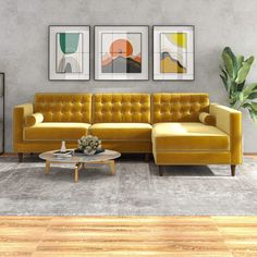 a living room with orange couches and pictures on the wall