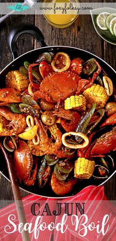 cajun seafood boil with corn on the cob in a skillet and garnishes