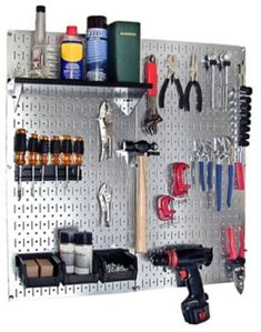 a metal pegboard with tools on it and the words diy & crafts above it