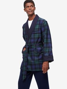 Our take on the classic smoking jacket draws inspiration from its history while keeping a modern finish with a minimalist cut. We’ve kept our design simple, with a tasteful shawl collar and traditional turn-back cuffs. It's fully lined and fastened by a matching belt tie for a relaxed fit. The tartan design showcases the colours of the Black Watch of the Royal Regiment of Scotland. Its rich, deep tones make for a stylish free time essential. Made from fine grade worsted wool, our smoking jacket Fall Blazer With Shawl Collar For Tailoring, Shawl Collar Blazer For Fall Tailoring, Winter Classic Blazer With Shawl Collar, Classic Winter Blazer With Shawl Collar, Classic Blazer With Hidden Button Closure For Daywear, Semi-formal Shawl Collar Blazer For Fall, Luxury Semi-formal Outerwear With Shawl Collar, Classic Formal Blazer With Fold Down Collar, Classic Long Sleeve Blazer For Daywear