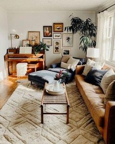 a living room filled with furniture and lots of plants on top of the couches