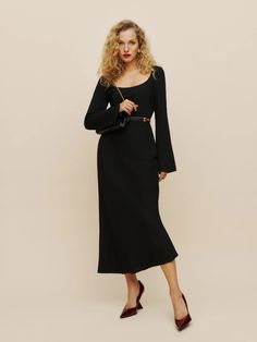 How classic. Shop the Kady Dress from Reformation, a long sleeve, midi length dress with a scoop neckline and a flared sleeve