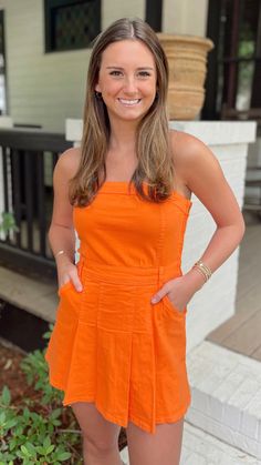 Get ready to make a statement in The Sunkist Romper! This strapless denim romper not only showcases a bold orange color, but also includes built-in shorts for added comfort. Don't sacrifice style for practicality, the Sunkist Romper has you covered. Model is wearing a size small Self: 86% Cotton 12% Polyester 2% Spandex Lining: 100% Polyester Casual Strapless Cotton Jumpsuit/romper, Summer Orange Cotton Jumpsuits And Rompers, Strapless Cotton Jumpsuits And Rompers For Spring, Strapless Denim Dress, Denim Romper, Dress First, Skirt Pants, Jeans Pants, Denim Dress