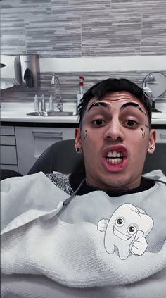 a man with his mouth open while in the dentist's chair