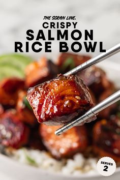 the cover of crispy salmon rice bowl with chopsticks sticking out of it