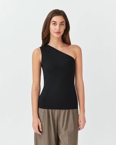 A staple for your warm-weather wardrobe and an essential layer for breezier days, woven from soft and sustainable Pima cotton. Seamless Summer Tops For Work, Summer Workwear Seamless Tops, Modern Seamless Tops For Spring, Effortless Black Tops For Spring, Effortless Black Top For Spring, One Shoulder Knit Top, One Shoulder Top, Shoulder Cut, One Shoulder Tops