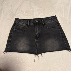 Never Worn Black High Rise Mini Skirt For Summer, Black High-rise Mini Skirt For Summer, Black Denim Short Skort, High Rise Black Mini Skirt For Summer, Black Denim Short Length Skort, Black Mini Skirt With Frayed Hem For Summer, Black Mini Skirt With Frayed Hem For Spring, Spring Black Mini Skirt With Frayed Hem, Black Cutoff Denim Skirt For Summer