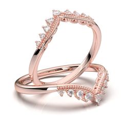 two rose gold wedding rings with diamonds on each side and an open diamond ring in the middle