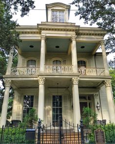 a large white house with columns on the front