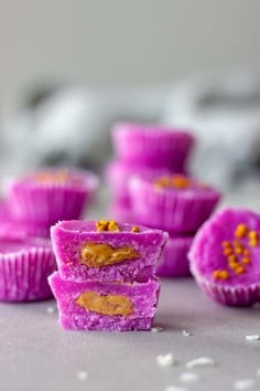 purple cupcakes with peanut butter on top and the words, how to make pita coconut peanut butter cups