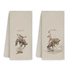 two towels with cowboy images on them, one is white and the other has brown