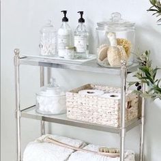 a shelf with towels, soaps and other items on it