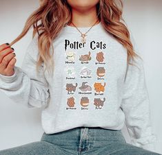 Gildan 1800 , Potter Cats Sweatshirt high quality UV Ink prints!  We advise machine washing with cold water and hanging to dry for longevity. Size up for an oversized look!  WHY SHOP MOODY?! 🌸 All of our designs are uniquely curated, designed, and made in our warehouse.  📦 Each of our orders are inspected for 100% accuracy, are packed securely, and shipped within 1-3 business days.  💕 We're here for you! We offer support 7 days a week!  🇺🇸Designed and manufactured in the USA! Ask me about b Harry Potter Sweatshirt, Pottery Gifts, Cat Sweatshirt, Fall Sweater, Cat Lover Gift, Fall Sweatshirt, Fall Sweaters, Book Lovers Gifts, Cat Lover Gifts