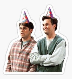 two men with party hats on their heads