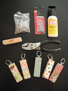 some crafting supplies are laid out on a table with scissors, glue, and other items