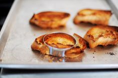 some food that is sitting on a metal pan with something in it's middle