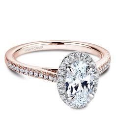 a rose gold engagement ring with an oval cut diamond and pave set diamonds around the band