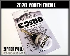 a badge with the words godo and two hands on it next to a pair of scissors