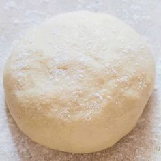 a ball of dough sitting on top of a table