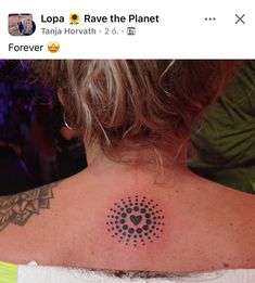 a woman with a tattoo on her back neck