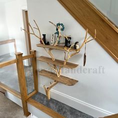 there is a shelf that has several items on it and some stairs in the background