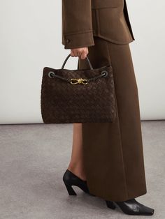 Bottega Veneta's suede 'Andiamo' tote has a retro shape that's perfectly sized to hold a few everyday essentials, like your phone, wallet and a book, on the morning commute. It's been made in Italy using the label's signature intrecciato technique and embellished with a gold-tone knot. Bottega Veneta Suede Bag, Bottega Veneta Andiamo Medium, Bottega Tote Bag, Luxury Woven Leather Bag For Work, Elegant Workwear Bag With Intrecciato Weave, Elegant Brown Woven Leather Bag, Elegant Formal Bag With Woven Leather, Intrecciato Weave Bags For Workwear, Elegant Woven Leather Bag For Formal Occasions