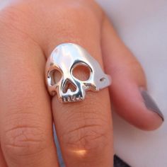 A cool unisex skull ring made of 925 sterling silver. Each piece is made by hand in my workshop in Hatton Garden, London. Much care and attention goes into creating each ring. If you don't know your UK ring size, please send me a message with your ring size and I will make it. Example Swedish ring size, EU, US, German, France etc. Finish: polished Width: Skull: 19mm, shank: 4mmThickness: 2 - 2.5mm  I spend a lot of time putting care and attention into each piece so you can rest assured you will Hand Cast Sterling Silver Skull Ring, Sterling Silver Skull Ring Gift, Sterling Silver Skull Print Rings As Gift, Sterling Silver Rings With Skull Print For Gift, Skull Shaped 925 Silver Ring Gift, 925 Silver Skull Ring Gift, Gift Skull Ring Stamped 925, Skull Ring, Rings For Men