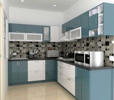 a kitchen with blue and white cabinets and tile backsplashes on the walls