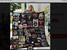 a woman is holding up a quilt made out of stickers