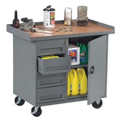 a workbench with tools and other items on it's top shelf for storage