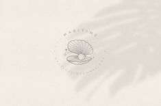 a white background with the words maritime and a seashell on it's side