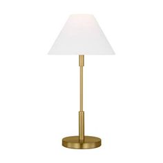 the brass table lamp has a white shade on it's base and is lit up