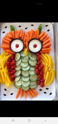 an owl made out of veggies and carrots