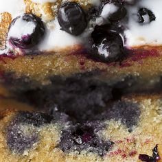 two pieces of blueberry bread with white icing