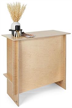 a wooden desk with a vase on top of it