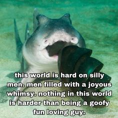 a shark with its mouth open and it's tongue out, in the water