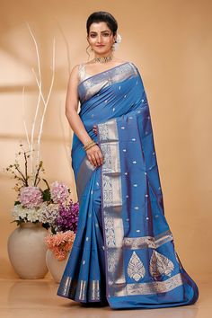 Elevate your ethnic wardrobe with this Exquisite Handwoven Banarasi Saree, a masterpiece of traditional Indian craftsmanship. Made from premium quality silk, this saree features intricate Zari work that showcases the rich cultural heritage of Banaras. Perfect for weddings, festivals, and special occasions, this Banarasi saree exudes elegance and sophistication. Each saree is meticulously handcrafted by skilled artisans, ensuring that every piece is unique and of the highest quality. The luxuriou Transitional Paithani Silk Traditional Wear With Zari Weaving, Paithani Silk Traditional Wear With Zari Weaving For Eid, Ceremonial Paithani Silk Saree For Festivals, Blue Katan Silk Saree For Ceremonial Occasions, Blue Katan Silk Ceremonial Traditional Wear, Ceremonial Blue Saree With Zari Work, Ceremonial Blue Katan Silk Traditional Wear, Ceremonial Silk Saree With Meenakari Detail, Ceremonial Silk Saree With Meenakari