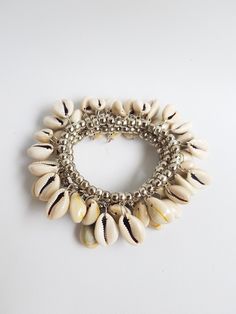 bohemian cowrie shell bracelet stack, summer bracelet set, stretch bracelet set, womans gift, beach funny jewelry, pulseiras de verão, boho Layering metal beads bracelets, you are buying 3 bracelets in this listing.  Each bracelet is 7.5 inches TAKE ADVANTAGE OF COMBINED SHIPPING Only 0.50€ (about 0.60 USD) for adicional item!! Handmade with love! Cheap Statement Bracelets For Beach, White Bohemian Stretch Bracelet For Festivals, Bohemian Cowrie Shell Bracelet, Bohemian Shell Bracelet For Vacation, White Cowrie Shell Beaded Bracelets For Vacation, Bohemian Shell-shaped Bracelets For Beach, Bohemian Shell-shaped Beaded Bracelets For Vacation, Handmade White Bohemian Charm Bracelet, White Handmade Bohemian Charm Bracelet