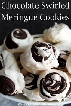 some white chocolate covered meringue cookies in a bowl with the words, best ever chocolate swirled meringue cookies just five ingredients