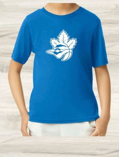 a young boy wearing a blue shirt with an image of a maple leaf on it