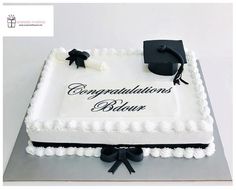 a graduation cake with the words congratulationss below it