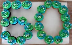 a birthday cake with green and blue frosting decorated like the number 50 on it