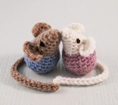 two small crocheted mice sitting next to each other